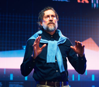 Man speaking at a conference.